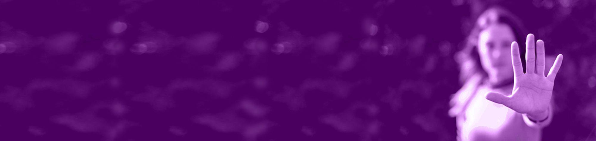 Woman with an outreached hand as if to say stay away.