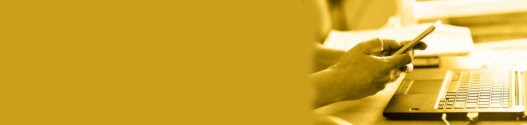 Woman holding mobile phone & laptop