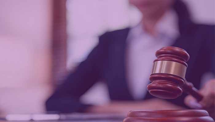 Gavel with person blurry in background