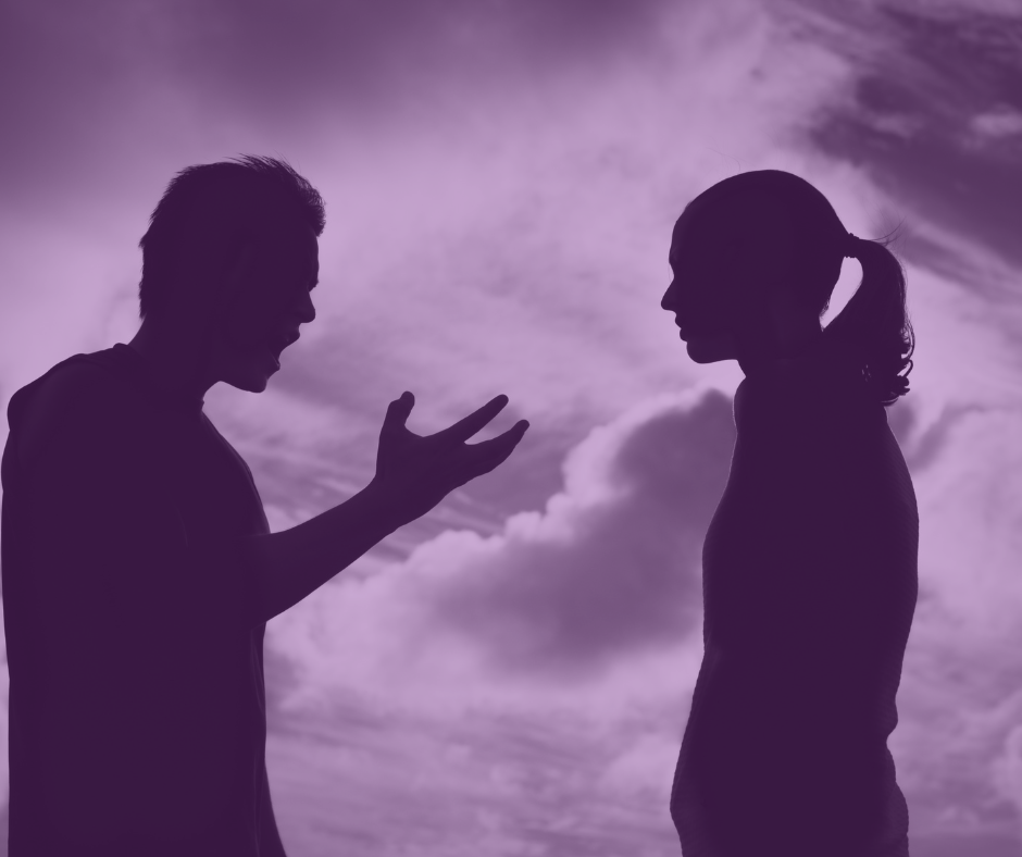 Silhouette of man yelling at woman